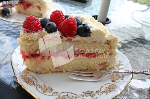 Image of Piece of delicious gateau with different kind of berries