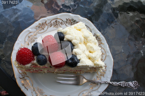 Image of Piece of gateau with strawberry, raspberry and blueberry