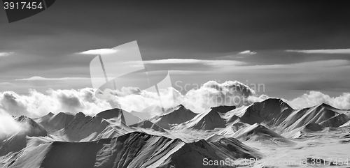 Image of Black and white panoramic view on cloudy mountains in evening
