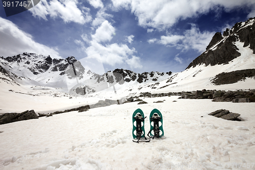 Image of Snowshoes in snowy mountains