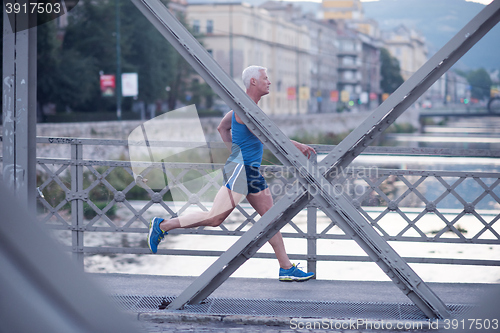 Image of handsome senior man  jogging