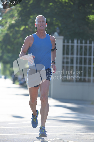 Image of handsome senior man  jogging