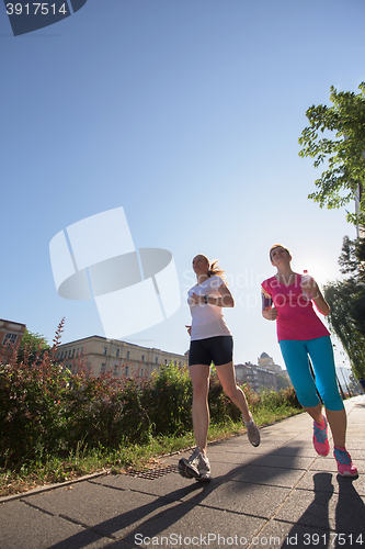 Image of female friends jogging