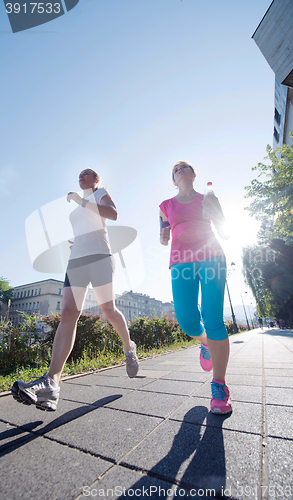 Image of female friends jogging