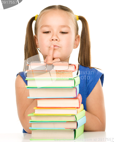 Image of Little girl is showing her books