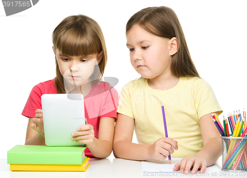 Image of Children are using tablet