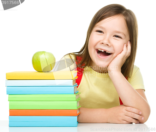 Image of Little girl with her books