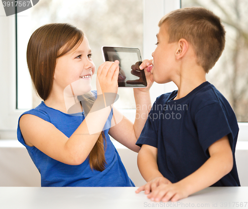 Image of Children are using tablet