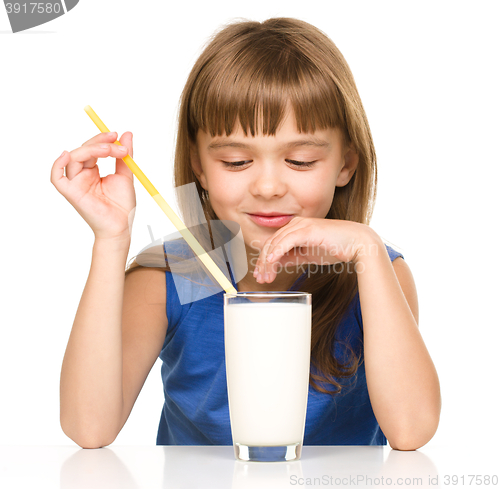 Image of Cute little girl with a glass of milk