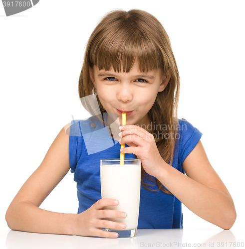 Image of Cute little girl with a glass of milk