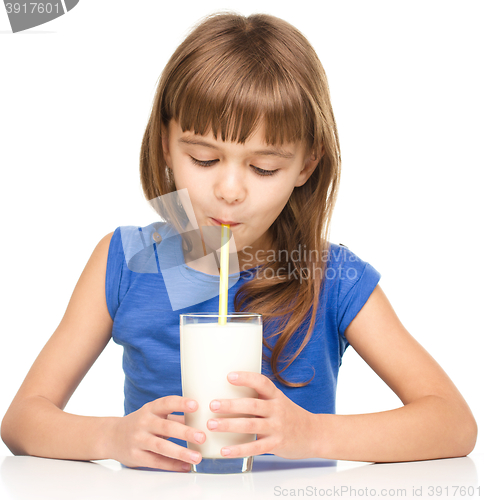 Image of Cute little girl with a glass of milk