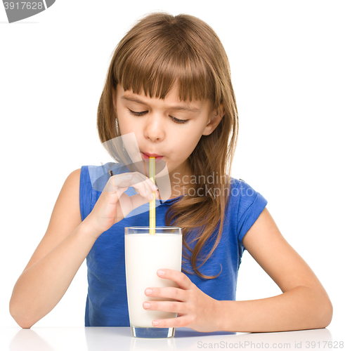 Image of Cute little girl with a glass of milk