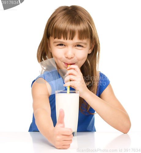 Image of Cute little girl with a glass of milk