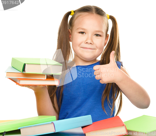 Image of Little girl is reading a book