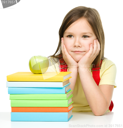 Image of Little girl with her books