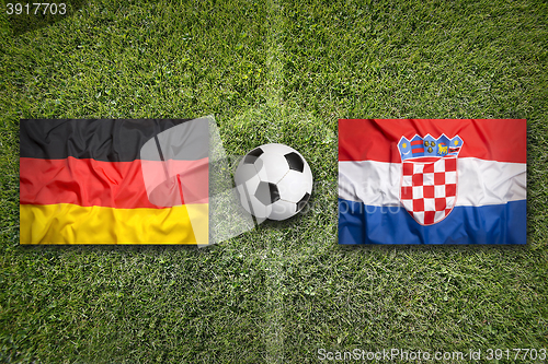 Image of Germany vs. Croatia flags on soccer field