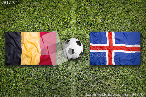 Image of Belgium vs. Iceland flags on soccer field