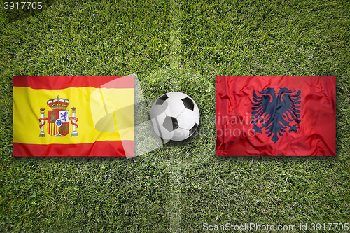 Image of Spain vs. Albania flags on soccer field