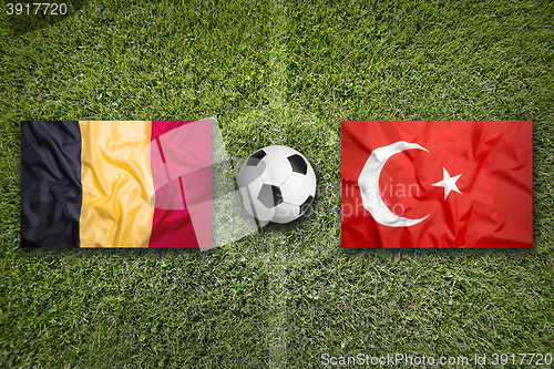 Image of Belgium vs. Turkey flags on soccer field