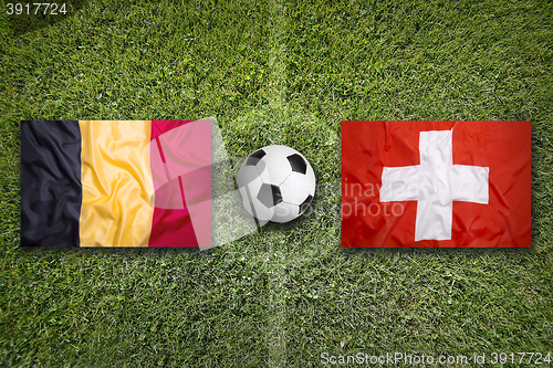 Image of Belgium vs. Switzerland flags on soccer field