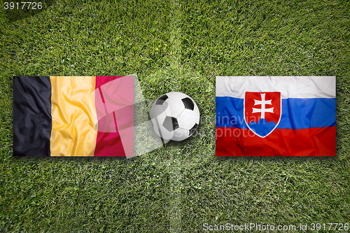 Image of Belgium vs. Slovakia flags on soccer field