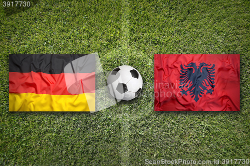 Image of Germany vs. Albania flags on soccer field