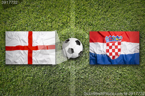 Image of England vs. Croatia flags on soccer field