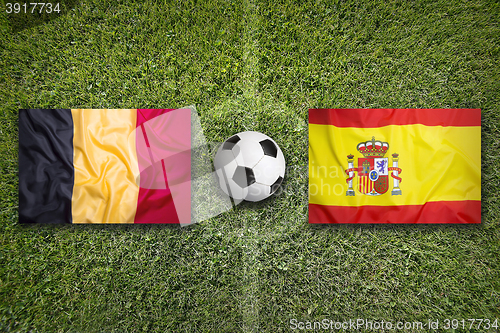 Image of Belgium vs. Spain flags on soccer field