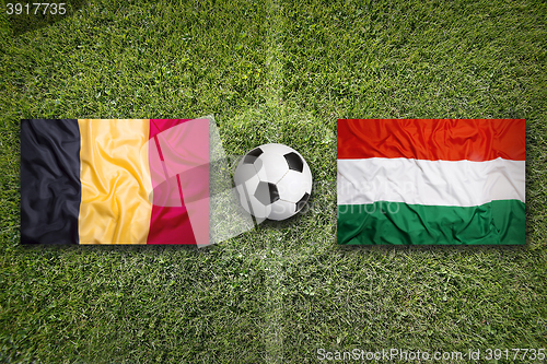 Image of Belgium vs. Hungary flags on soccer field