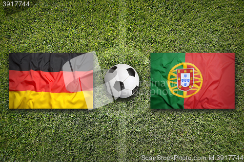 Image of Germany vs. Portugal flags on soccer field