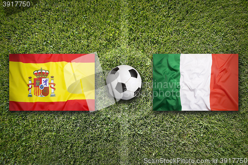 Image of Spain vs. Italy flags on soccer field