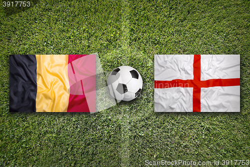 Image of Belgium vs. England flags on soccer field