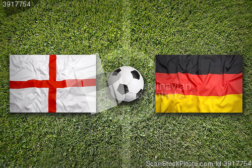 Image of England vs. Germany flags on soccer field