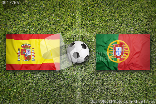 Image of Spain vs. Portugal flags on soccer field