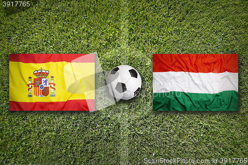 Image of Spain vs. Hungary flags on soccer field