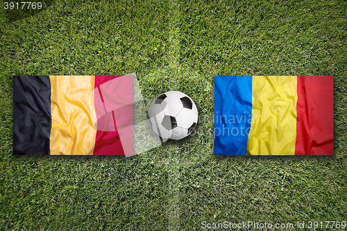 Image of Belgium vs. Romania flags on soccer field