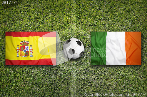 Image of Spain vs. Ireland flags on soccer field