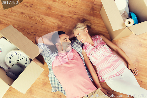 Image of couple with big cardboard boxes moving to new home