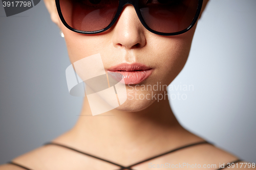 Image of close up of beautiful woman in black sunglasses