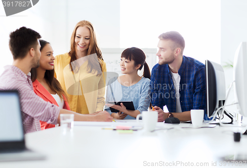 Image of happy creative team or students working at office