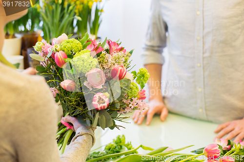 Image of close up of florist woman and man at flower shop