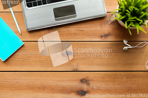 Image of close up of laptop computer on wooden table