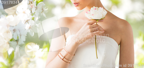 Image of close up of beautiful woman with ring and bracelet