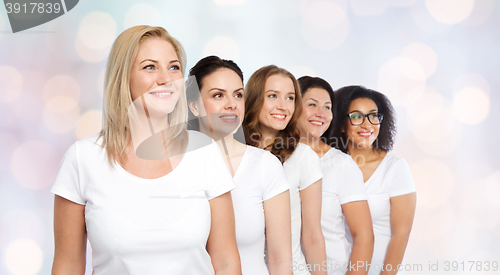 Image of group of happy different women in white t-shirts