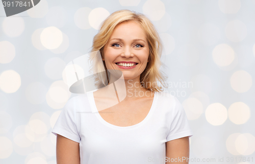 Image of smiling woman in blank white t-shirt