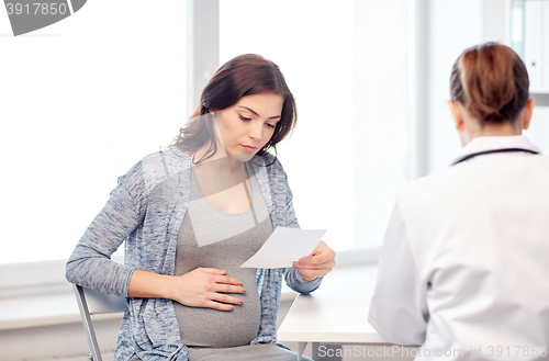 Image of gynecologist doctor and pregnant woman at hospital