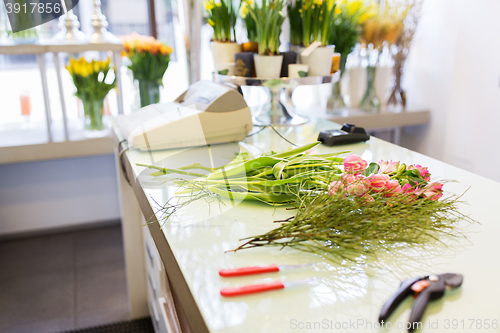 Image of close up of floristic tools on flower shop counter