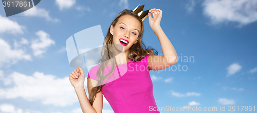 Image of happy young woman or teen girl in pink dress