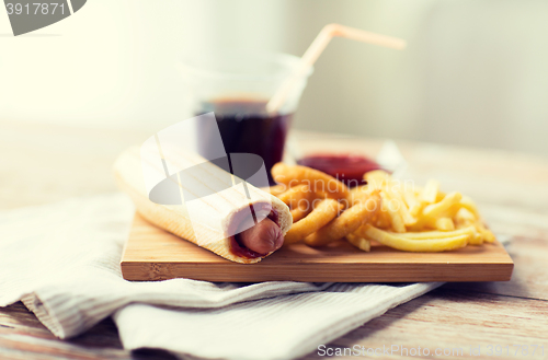 Image of close up of fast food snacks and drink on table