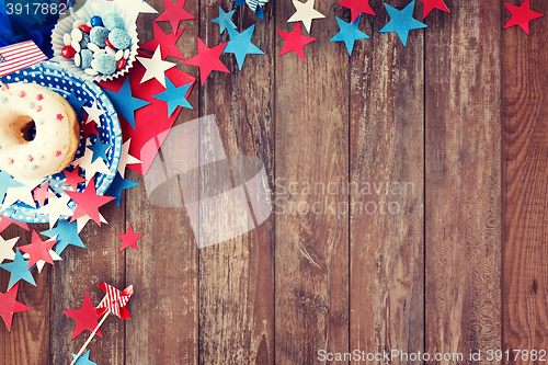 Image of donut with candies and stars on independence day